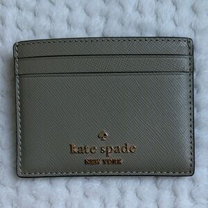Kate Spade Small Slim Card Holder in Oyster Shell Color With Gold Logo